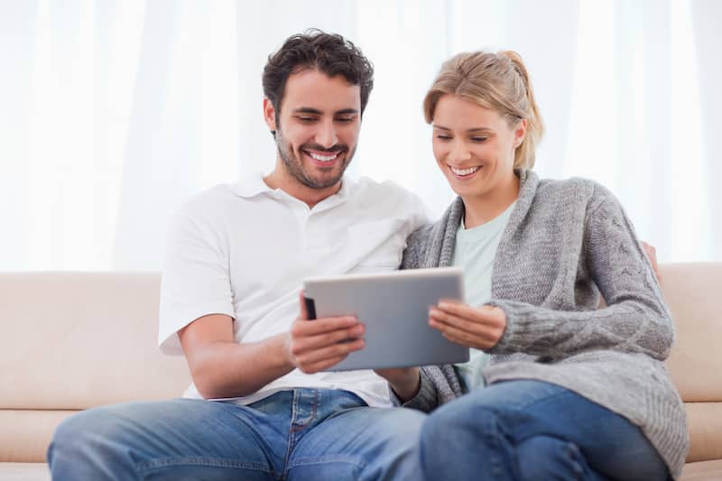 Couple Looking at Tablet